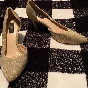 Gold sparkly high heeled shoes